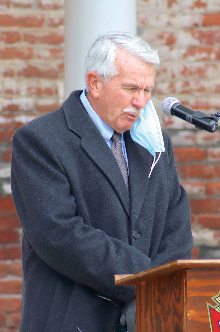Reverend Mike Whitaker, former pastor of Whitesville Christian and New Hope Christian churches, delivers the opening prayer and later the benediction at Canine Plaza during services on Veterans Day.